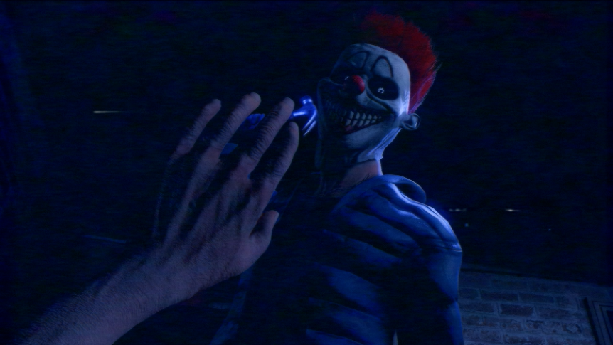 In-game screenshot; The player is being attacked by a man with a clown mask. The man is swinging a hammer at the player. The player is holding their hand up in front of their face.